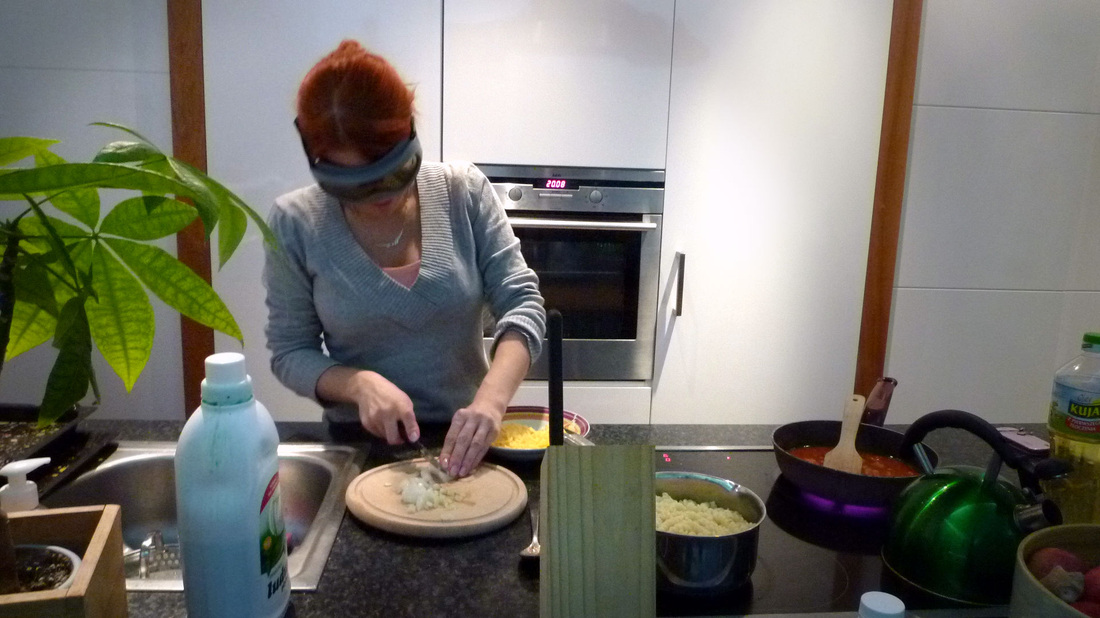 Maja chopping onions.